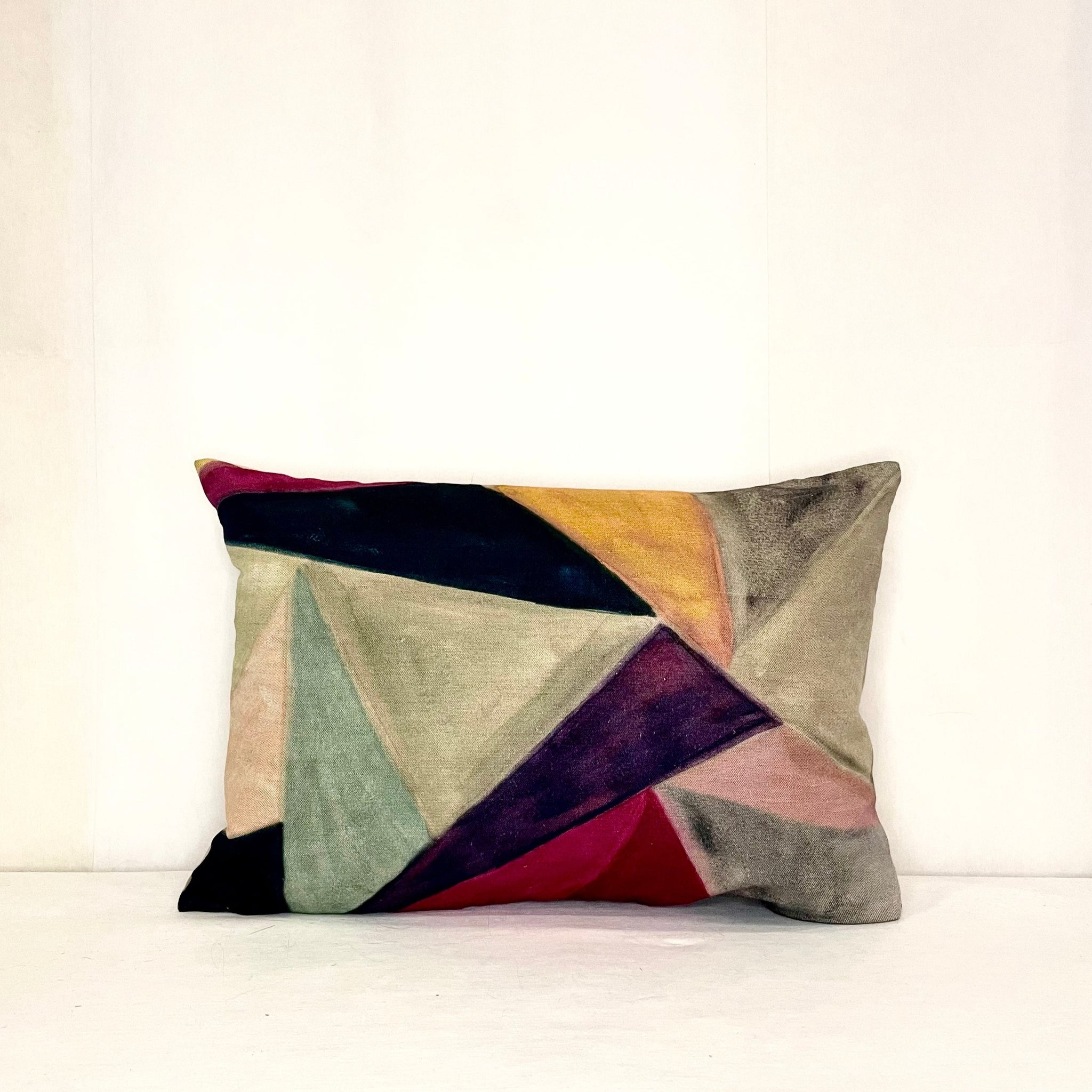 Pink, green, purple, orange and tan colors on this beautifully designed pillow. 